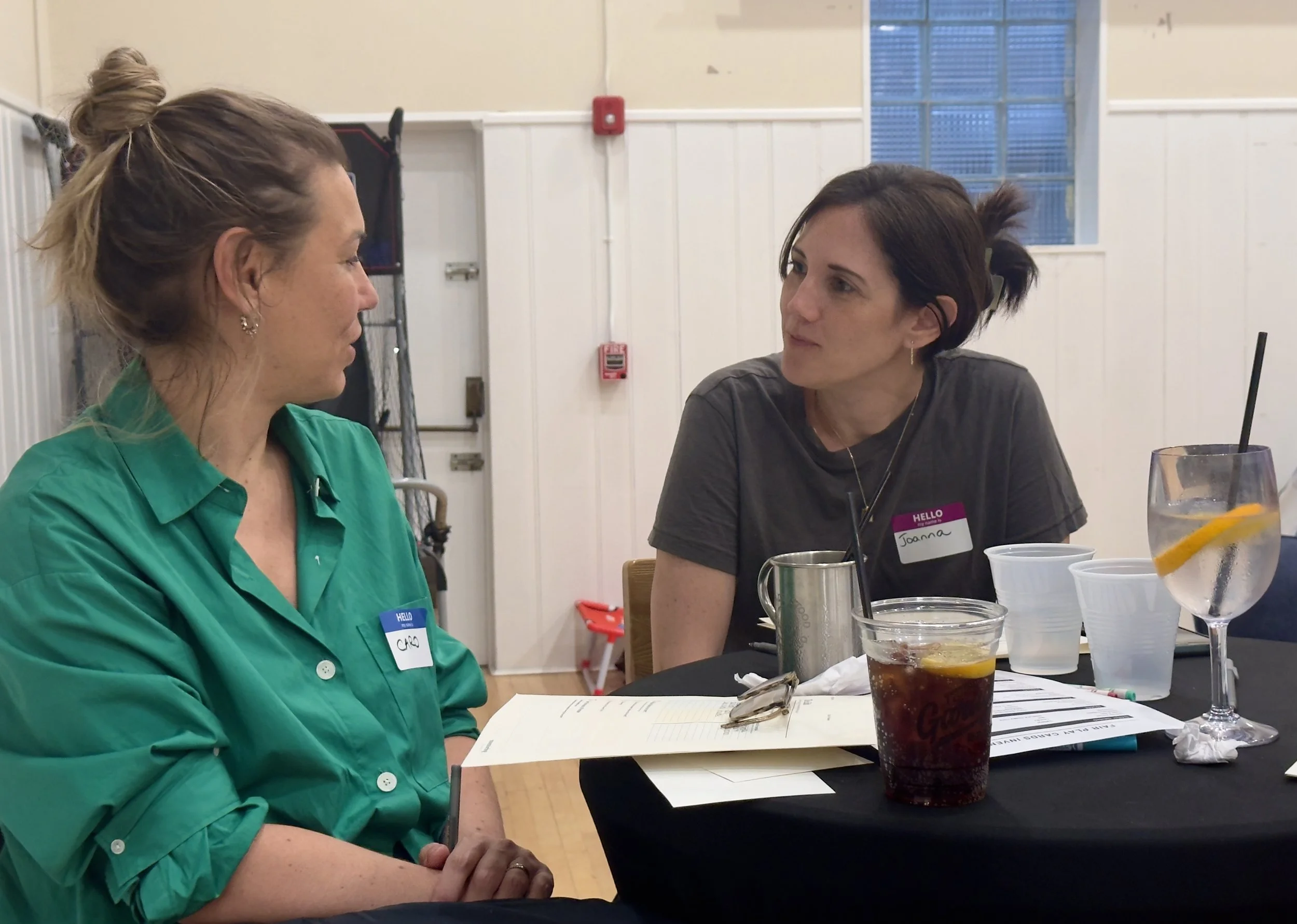 Two women engaged in a supportive, one-on-one conversation during a Momtoring event in New Jersey.