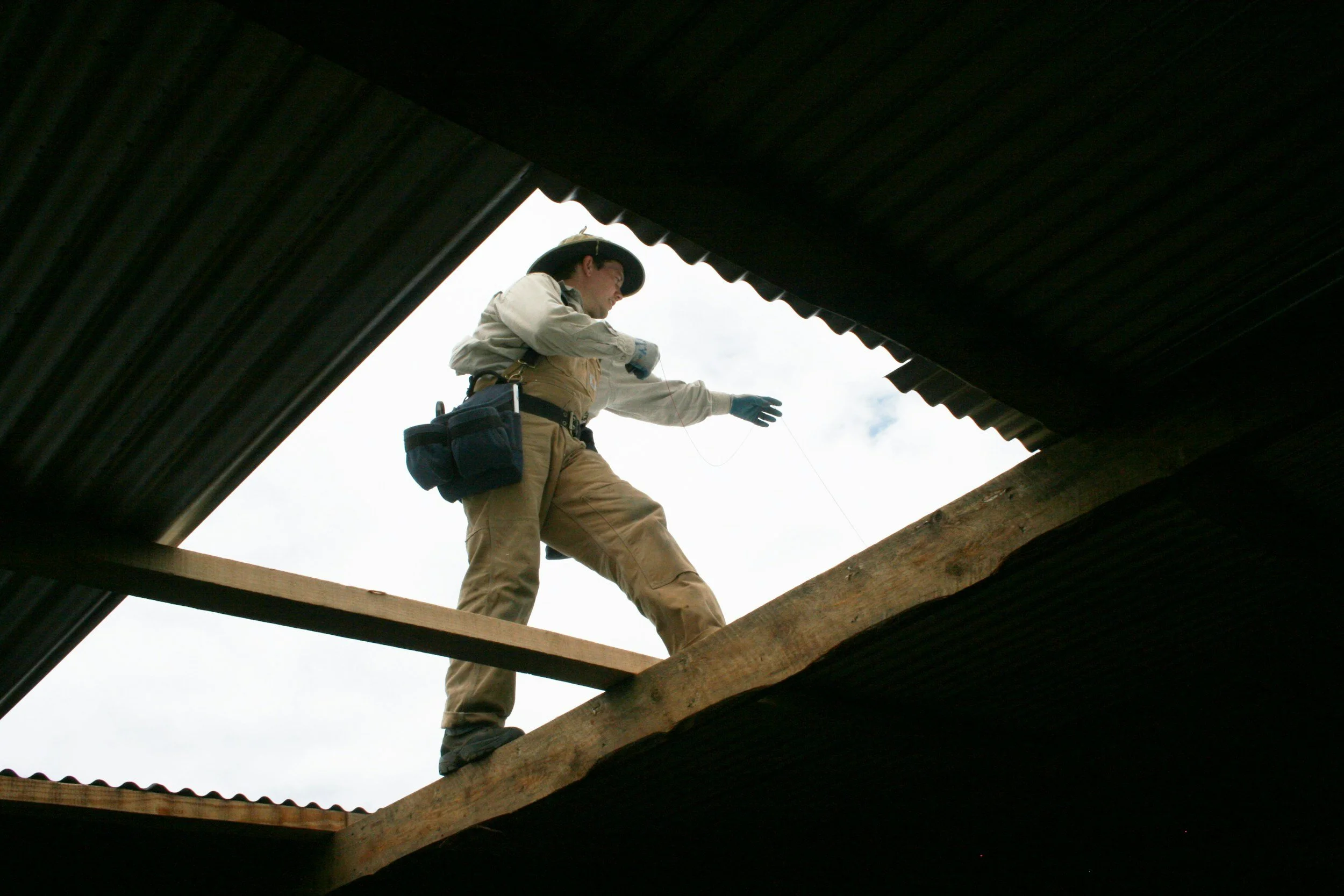 A man inspecting the interior of a home for mold.