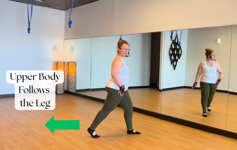 Bella stepping back into a reverse lunge and the body follows. Knee alignment.