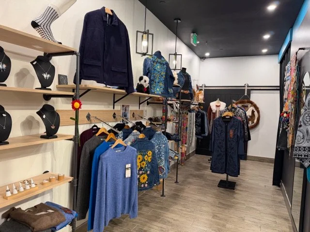 Alpaca clothing and accessories display in a alpaca clothing store, featuring alpaca jackets, alpaca sweaters, alpaca scarves, and jewelry.