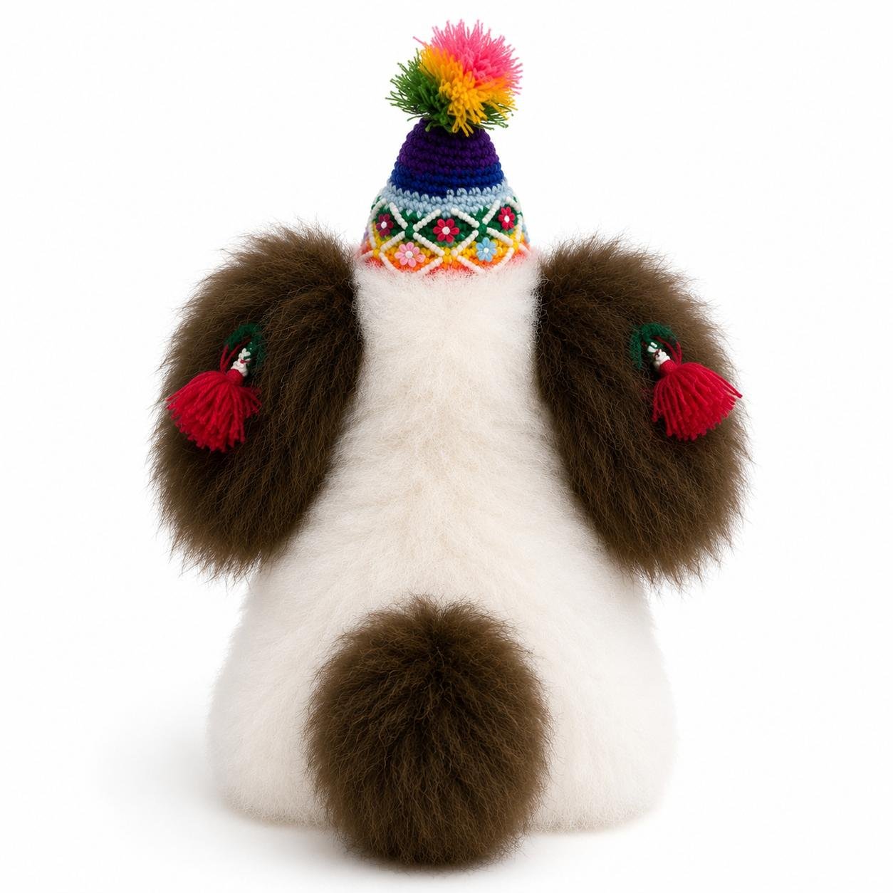 Back of handmade alpaca dog showing fluffy brown ears, tail, and decorative Andean hat..jpg