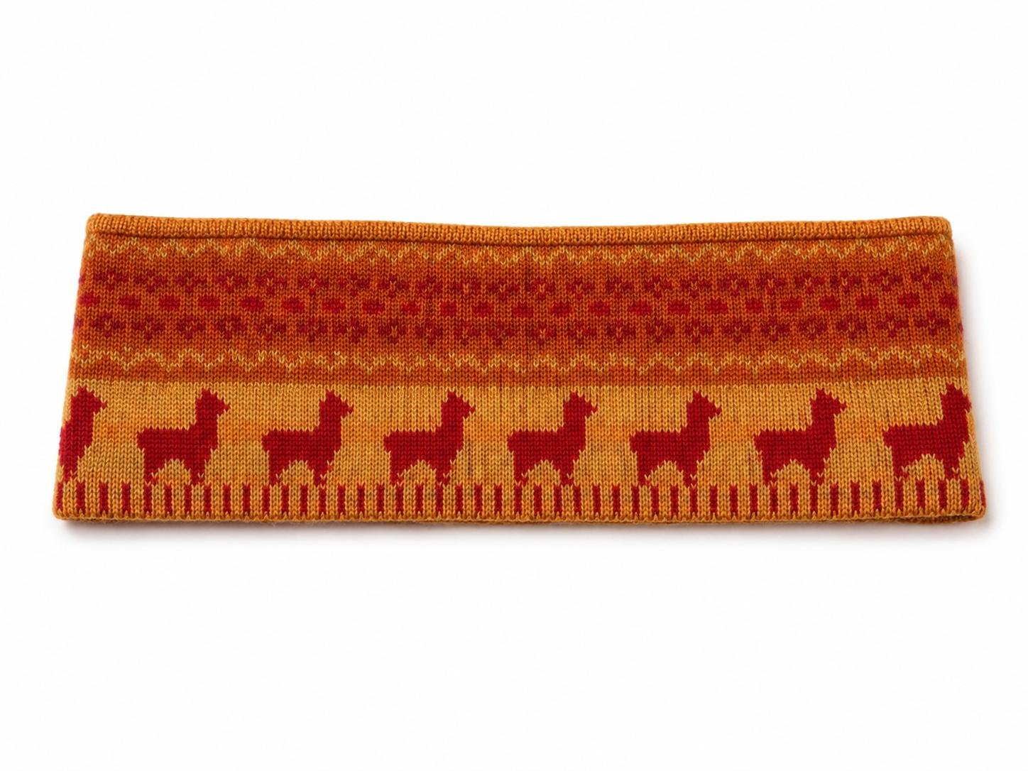 Ayni alpaca headband in Golden Mustard with warm orange, red and yellow knit pattern featuring repeating llamas.jpg