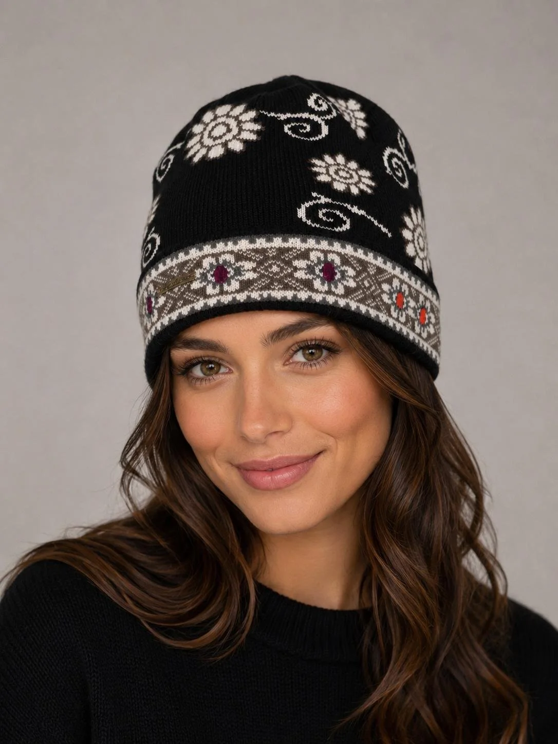 Hand-embroidered alpaca beanies in multiple colors featuring floral and geometric designs..jpg