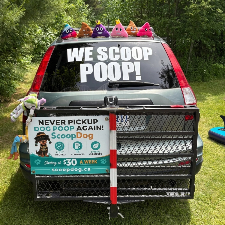 Scoop Dog technician with the Dog Waste Removal banner, Ottawa