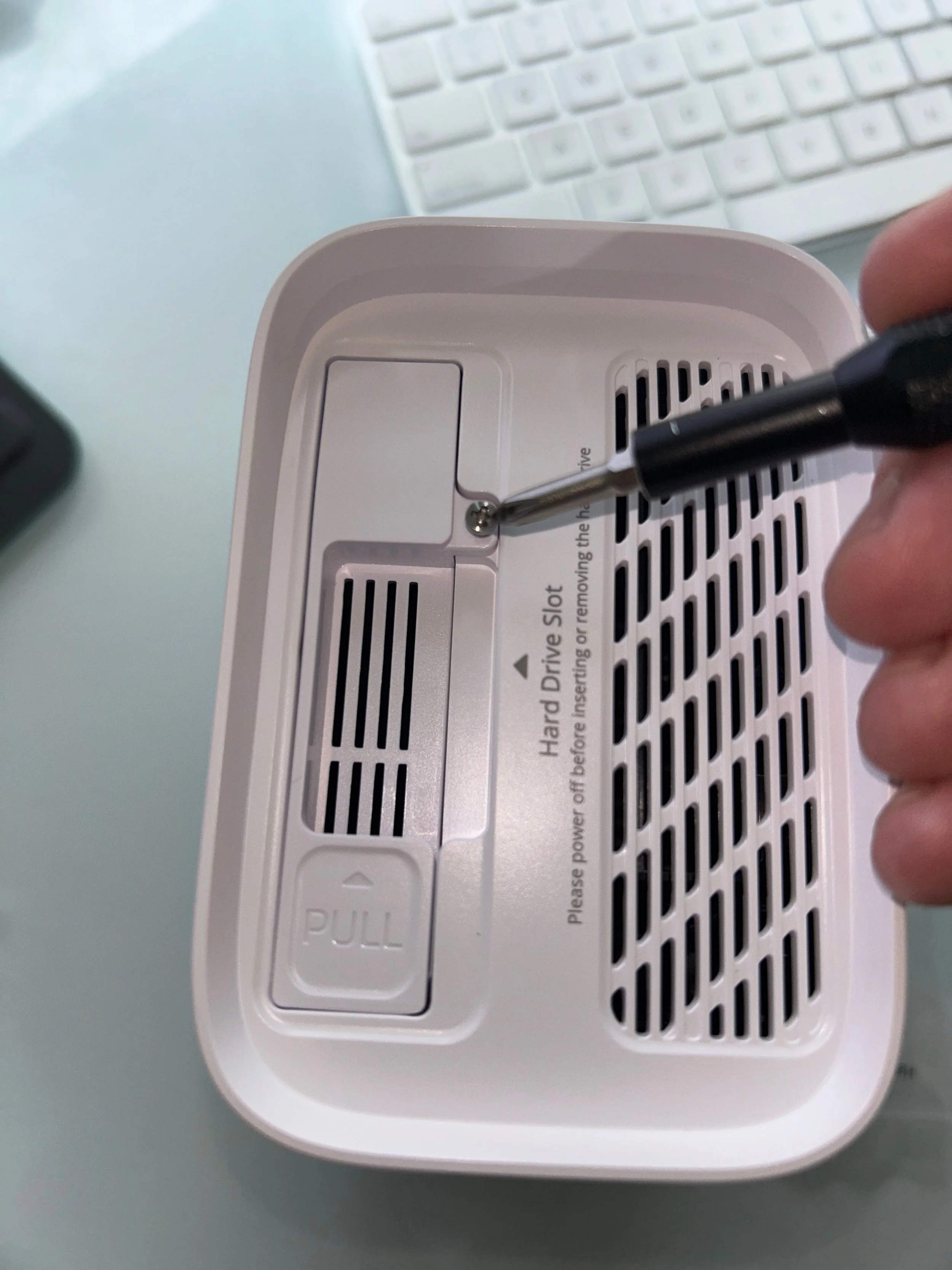  You will see the screw that allows you to open the SSD tray.  