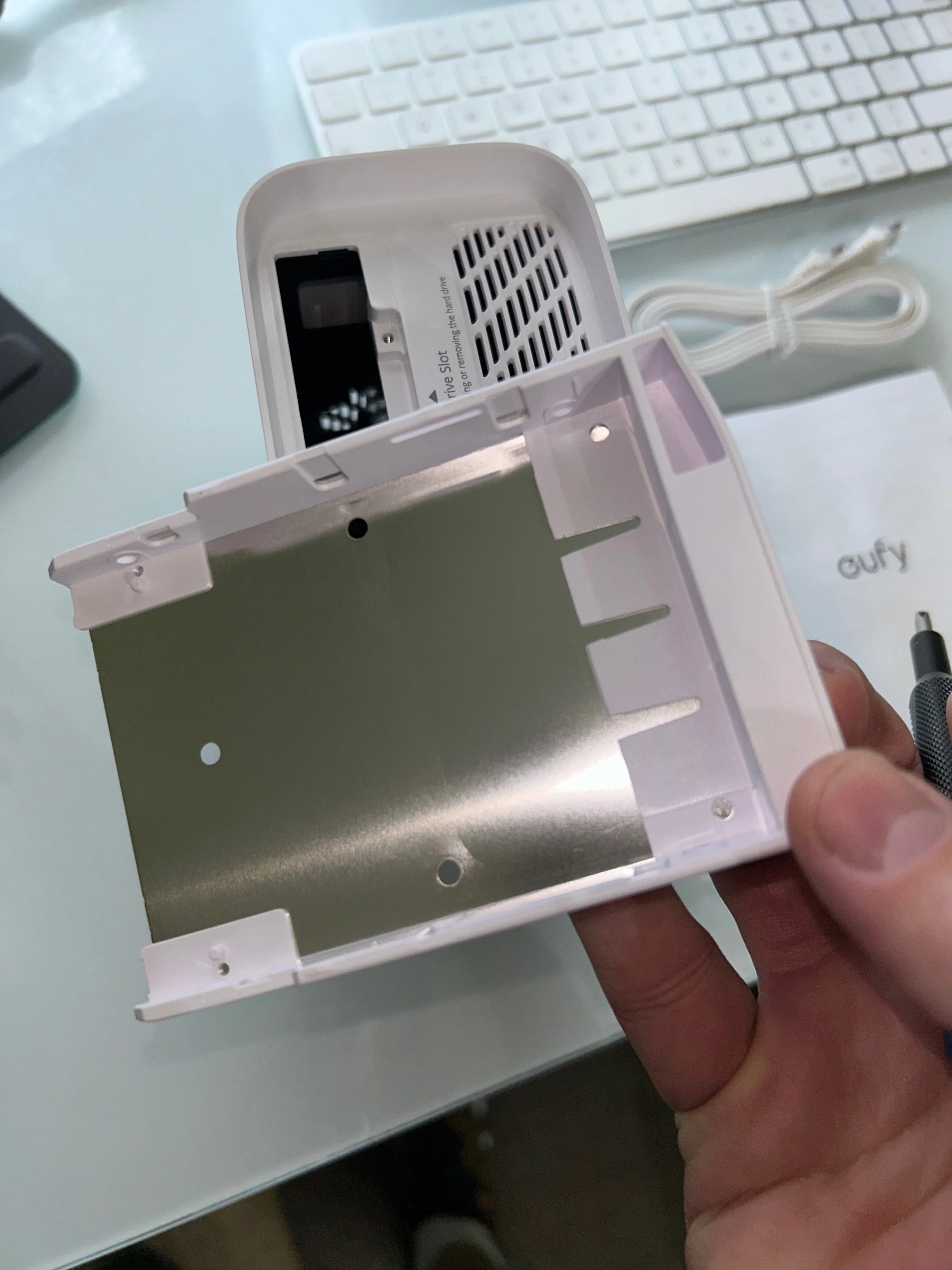  This is the tray for the SSD.  There are four screw slots on the side to mount the SSD 
