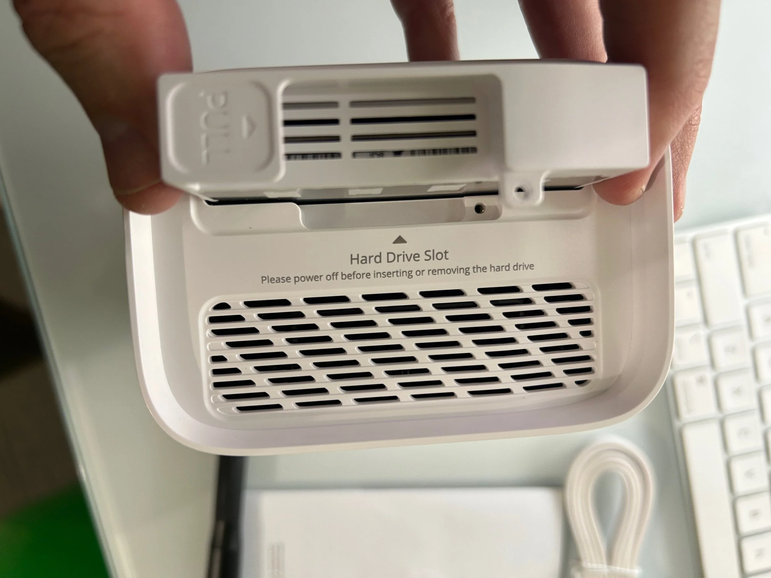  You slide the tray back in the slot and follow the directions on the app to format the drive. 