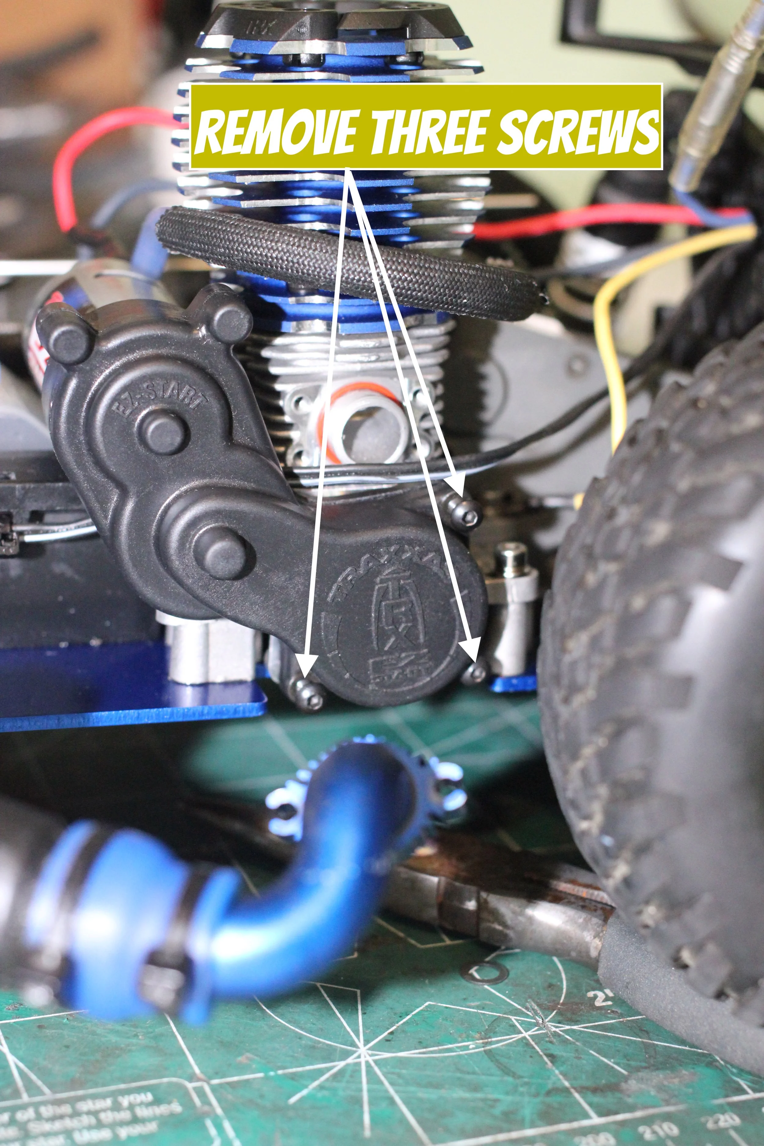 Three screws that hold the EZ start system to Nitro Motor