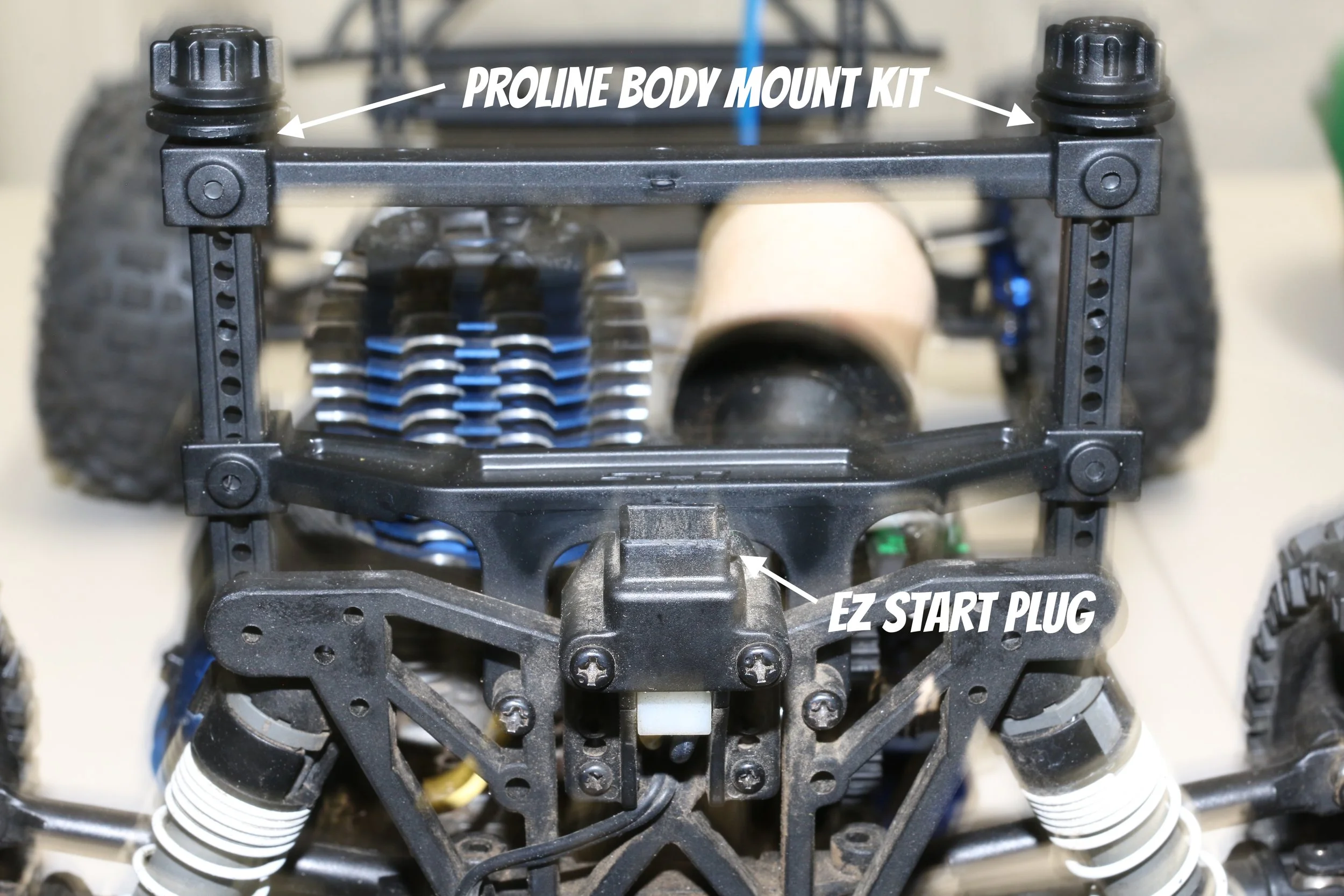 shows traxxas ez start and the proline body kit not being able to fit properly for suspension clearance on traxxas slash nitro