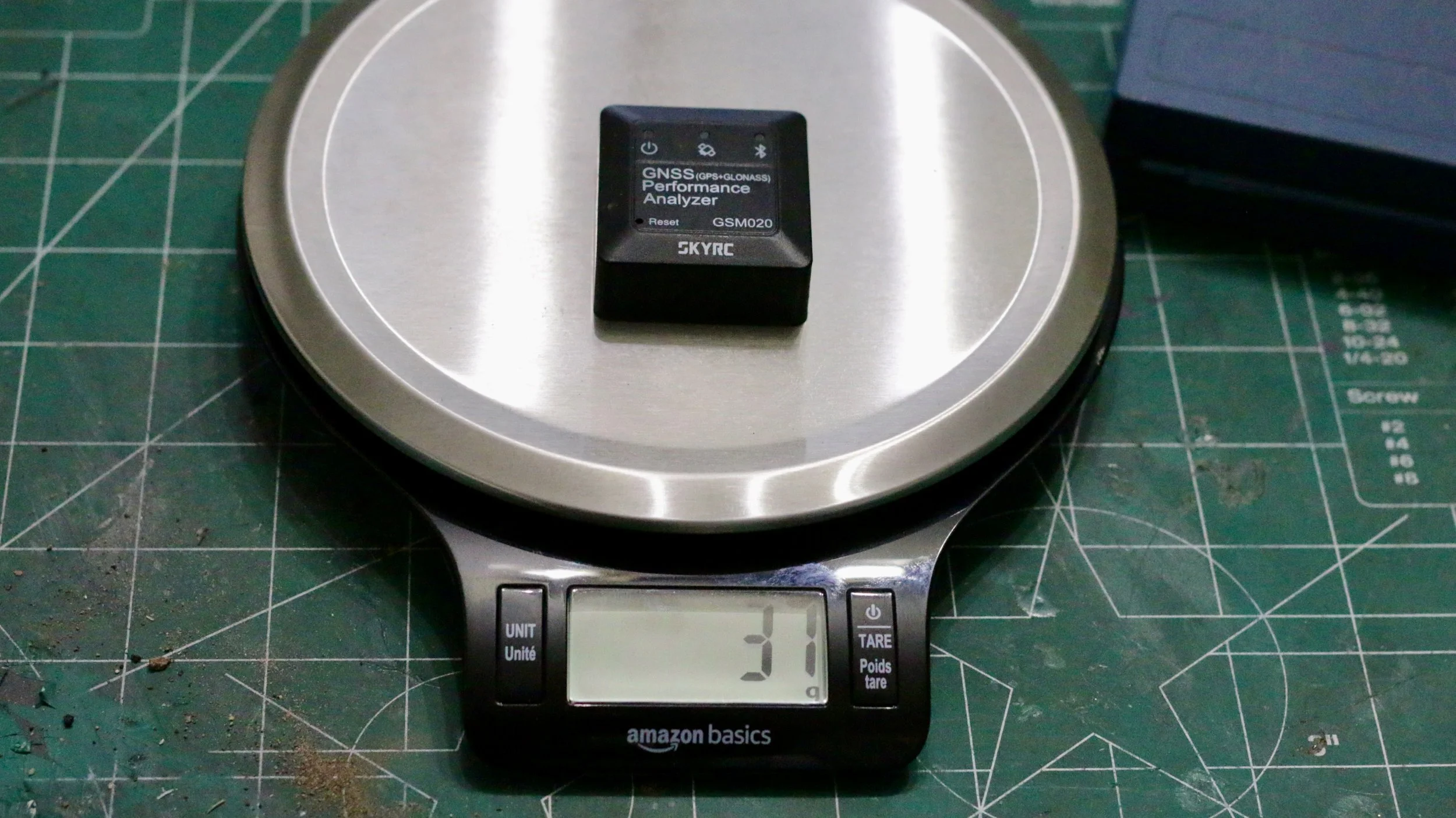 Shows the weight of the Sky RC GNSS.  The weight is 37 Grams