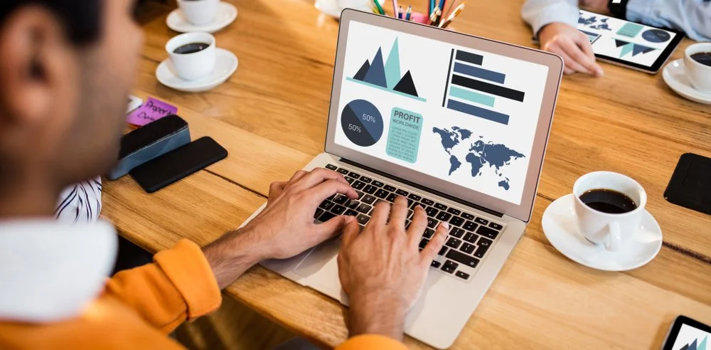 Analyst reviewing reputation research data and insights on a laptop — evidence-based advisory for executive decision-making