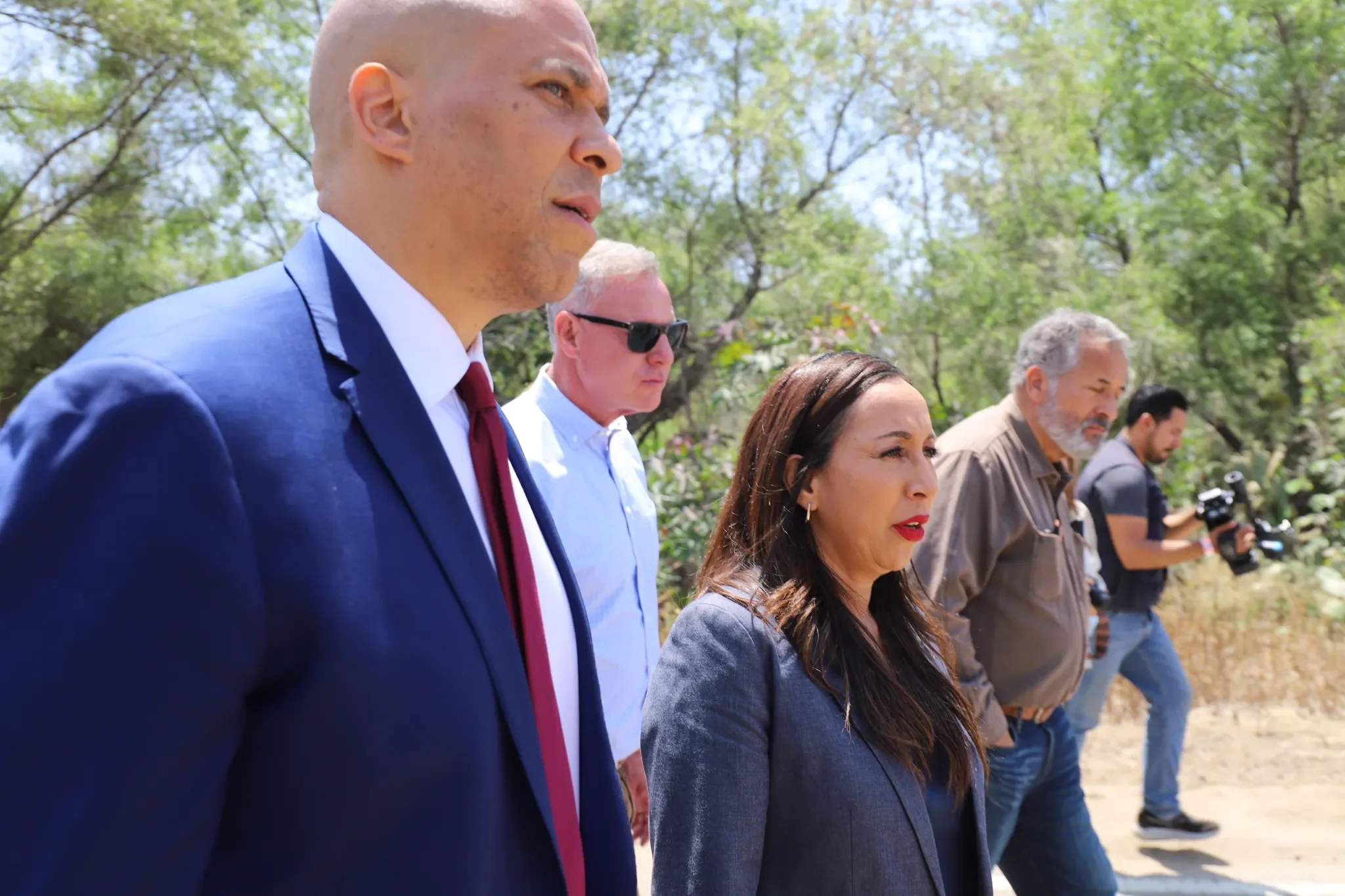 Senator Cory Booker visits the Tijuana River alongside Imperial Beach Mayor Paloma Aguirre, Rep. Juan Vargas and Rep. Scott Peters on May 29, 2025 in Imperial Beach / Photo for Voice of San Diego