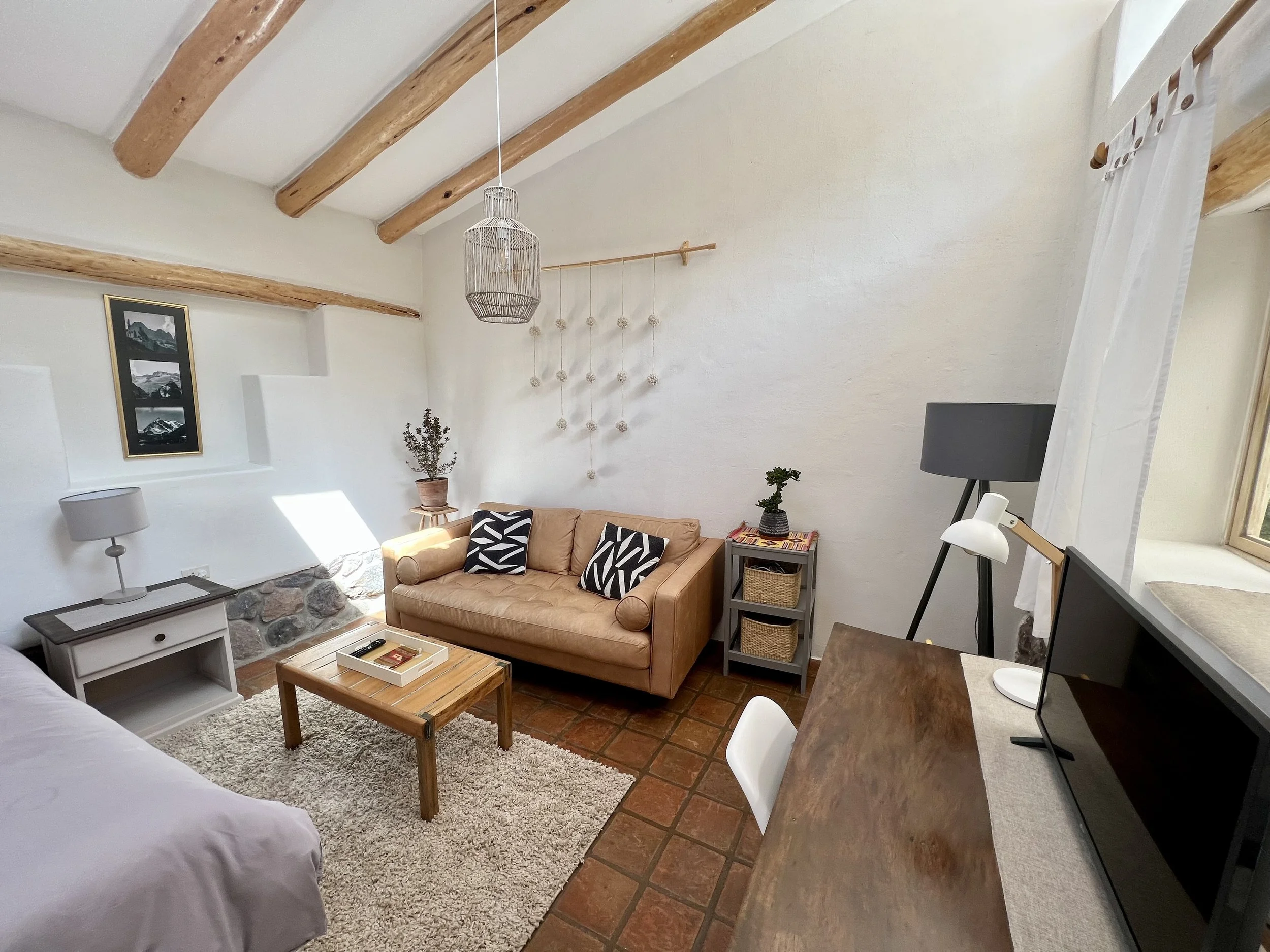 Equipped with a King sized bed (shown), and a private lounge area