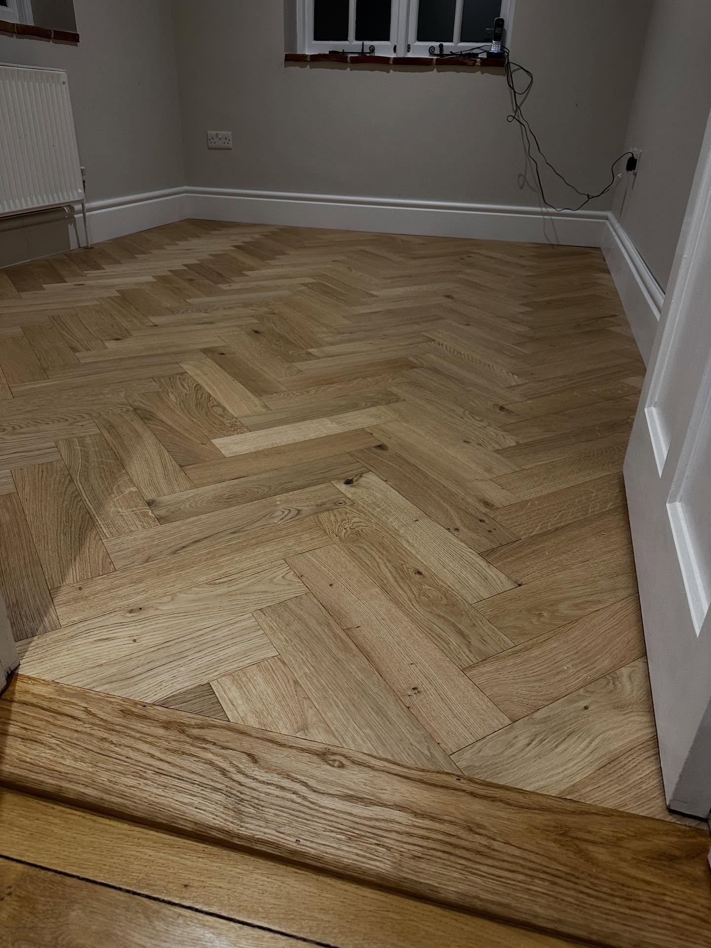 Penultimate job before the Christmas break 🎄

We uplifted the existing carpet and laminate, installed flooring-grade plywood, then laid this beautiful brushed @v4woodflooring herringbone with bespoke solid oak thresholds. 
One job left before a well