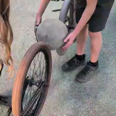 ONLY AT TRIANGLE! Ingenious play as one young person practiced fine motor skills, creativity and physics with a dose of determination to get 4 wheels a spinning 👏🧠⚙️🚲