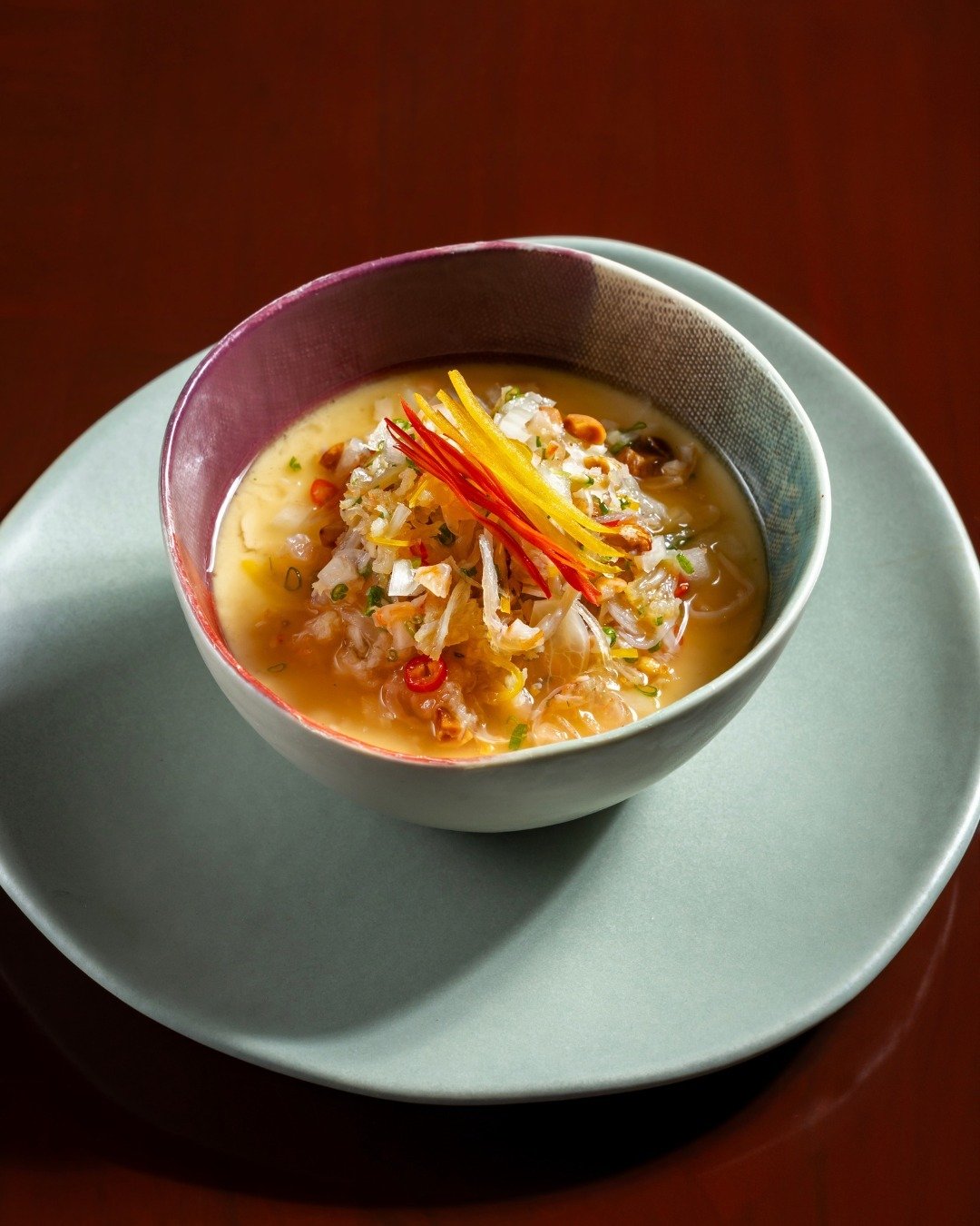 We create our own scallop dashi to give this steamed egg dish an umami bomb. It&rsquo;s then topped with a crunchy dried scallop garnish to create a bite unlike anything you have ever tried before.