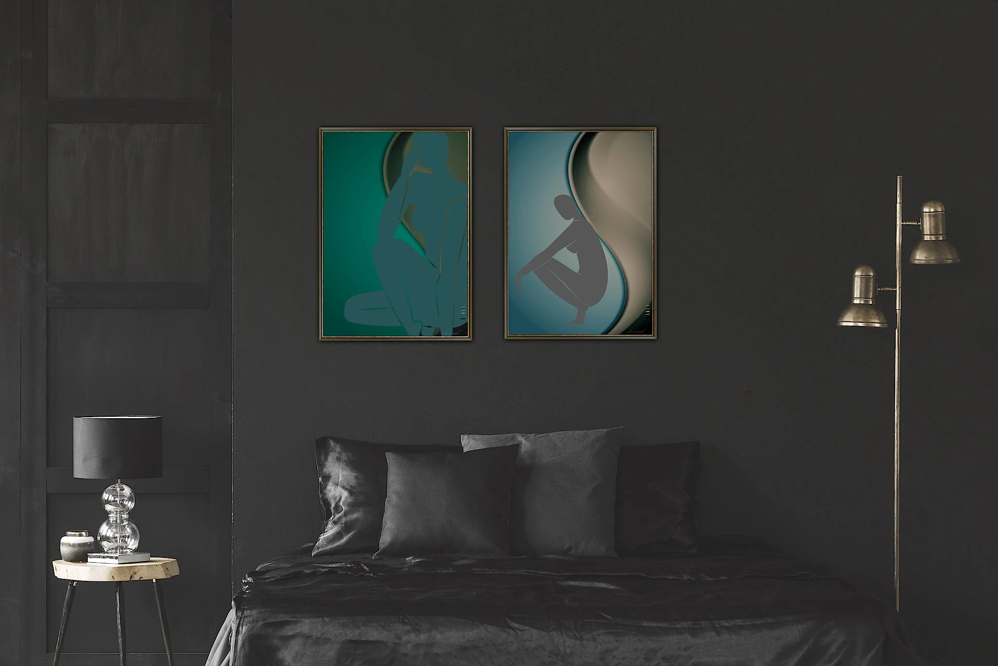 A dark bedroom with a black bed, gray pillows, a small wooden side table with a lamp and decorative items, black walls, two framed abstract art pieces of female figures, and brass floor lamps.