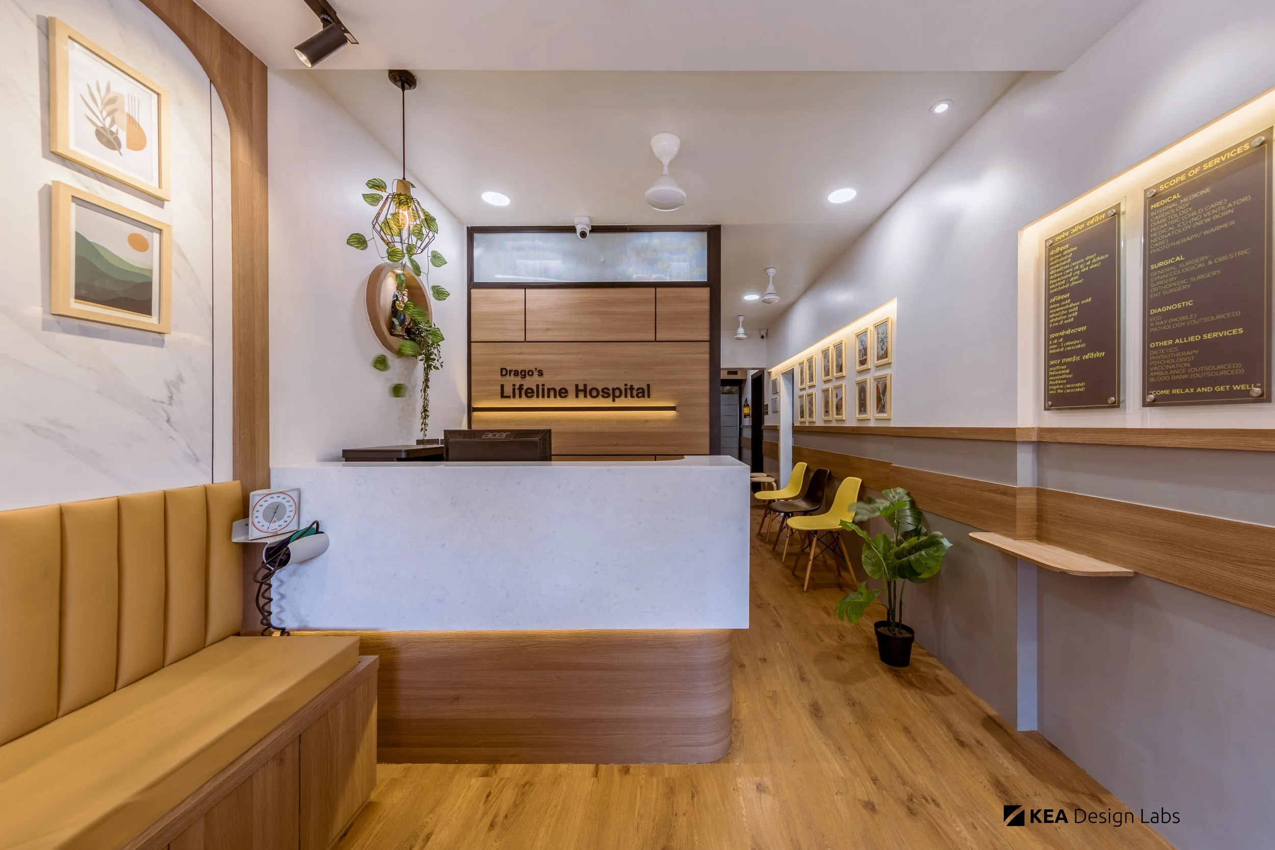 3-reception-table-design-healthcare-clinic-peaceful-aesthetics-calming-interiors-premium-budget-friendly-bright-colourful-wood-flooring-wall-arts-hospital.jpg