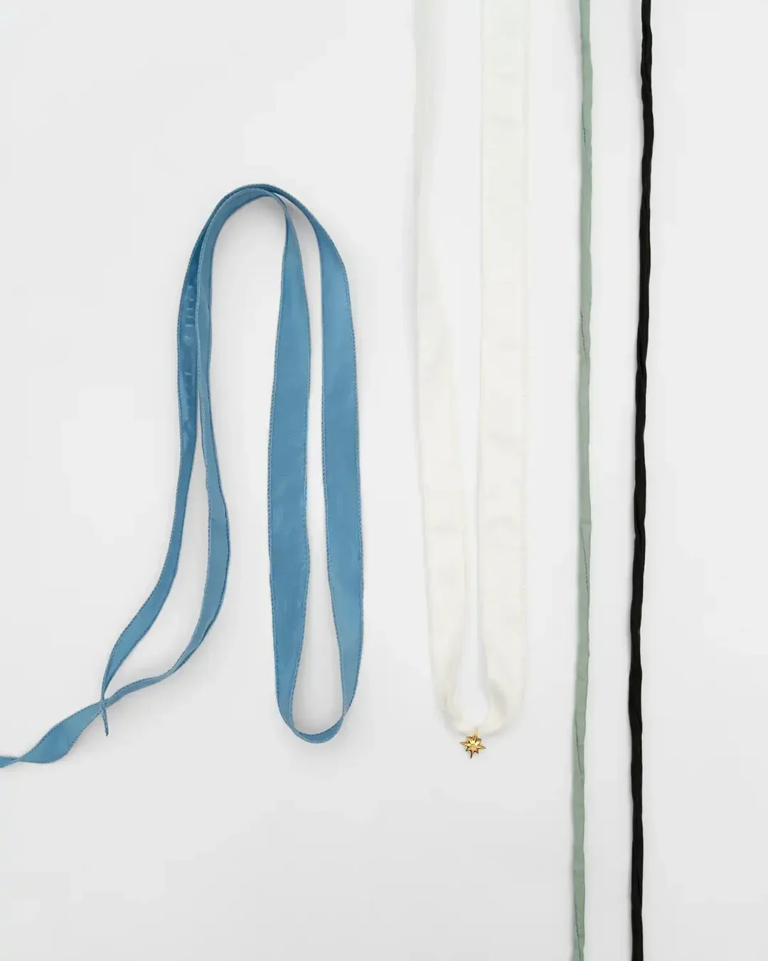 Gold-Plated Silver Star Pendant with a Mix of Silk Ribbons