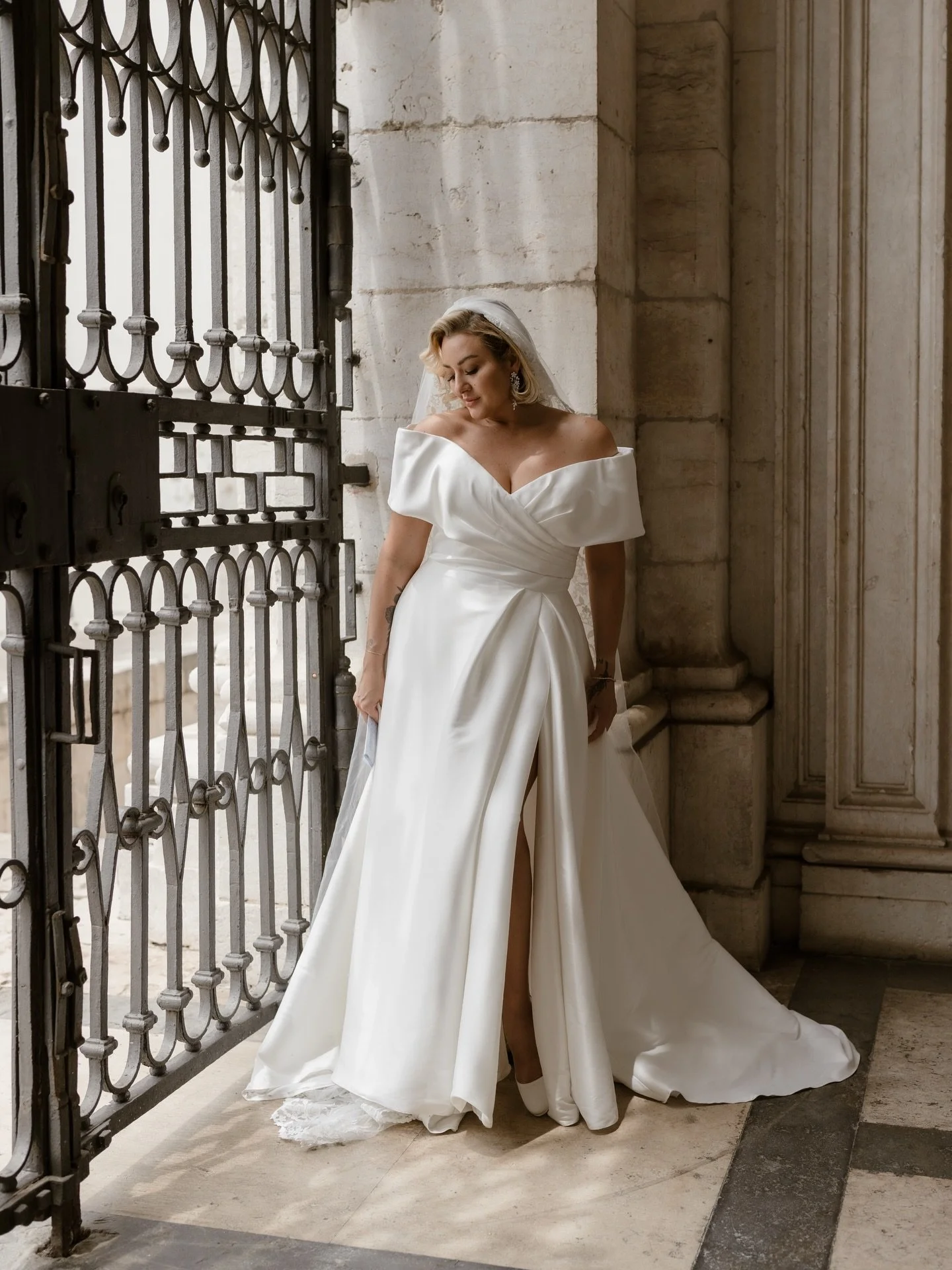 A quiet pause before forever.

Just moments before walking into the church, Chinae asked for one last thing, a few portraits, just for her.
No rush. No crowd. Just her breath, the weight of the dress, and the realization that everything was about to 