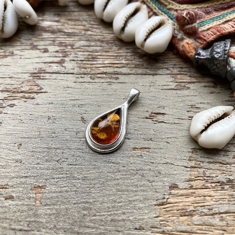 simple sterling silver and amber pendant.jpeg