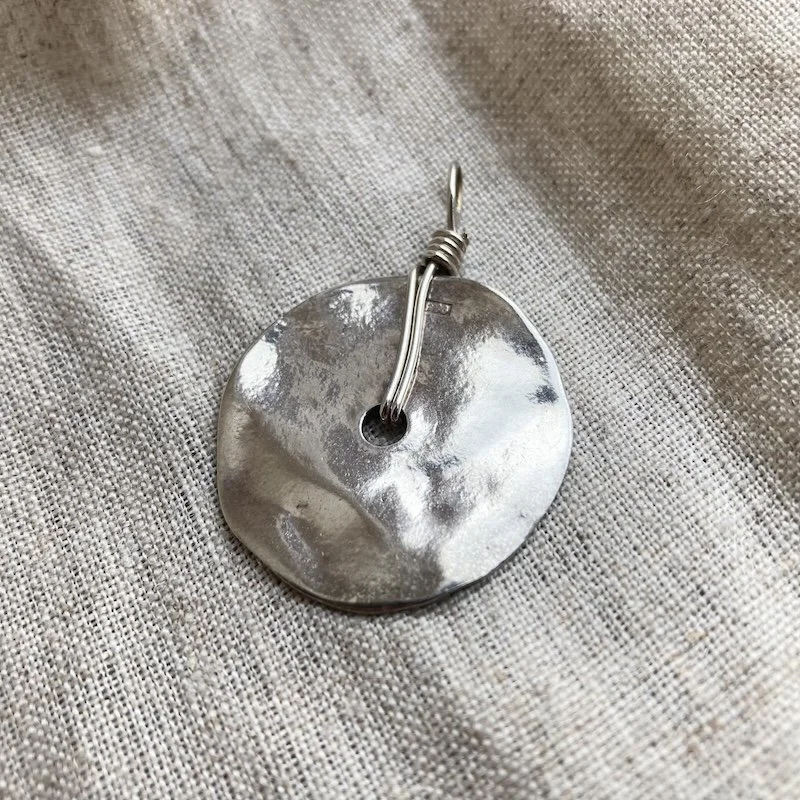 textured solid silver pendant.jpeg
