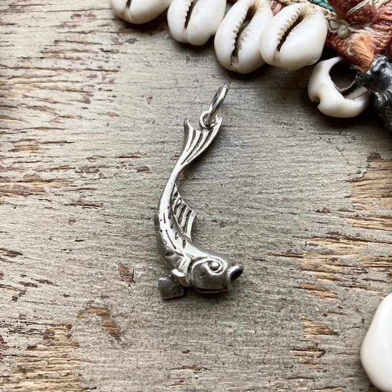 vintage sterling silver fish pendant.jpeg