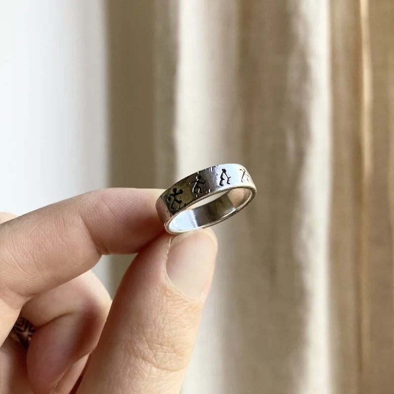 vintage sterling silver figures ring 1.jpeg