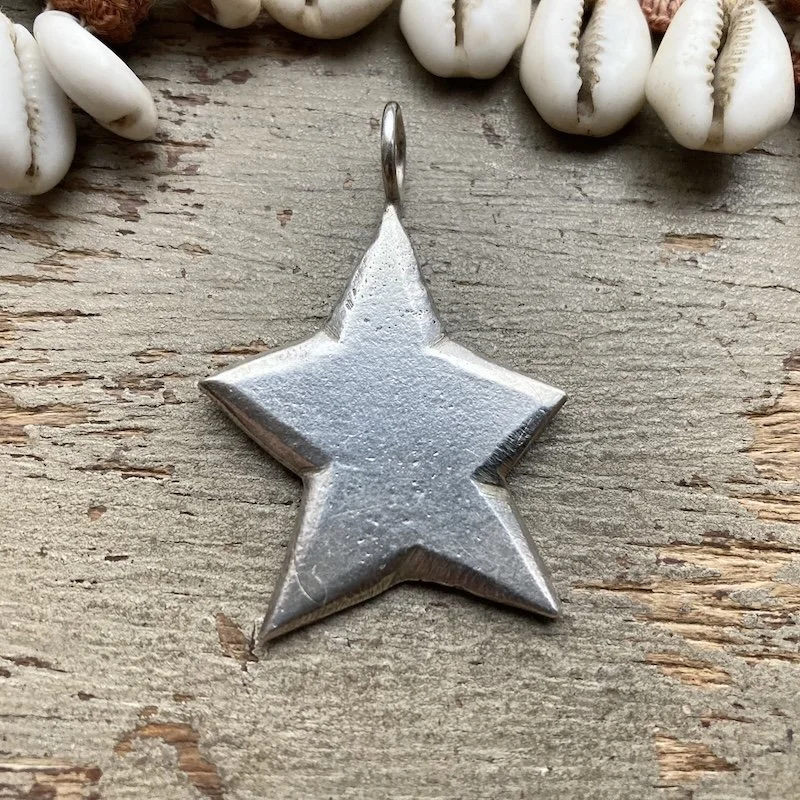 funky solid silver star pendant.jpeg