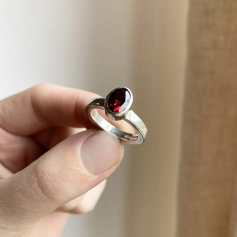 simple sterling silver and garnet ring 1.jpeg