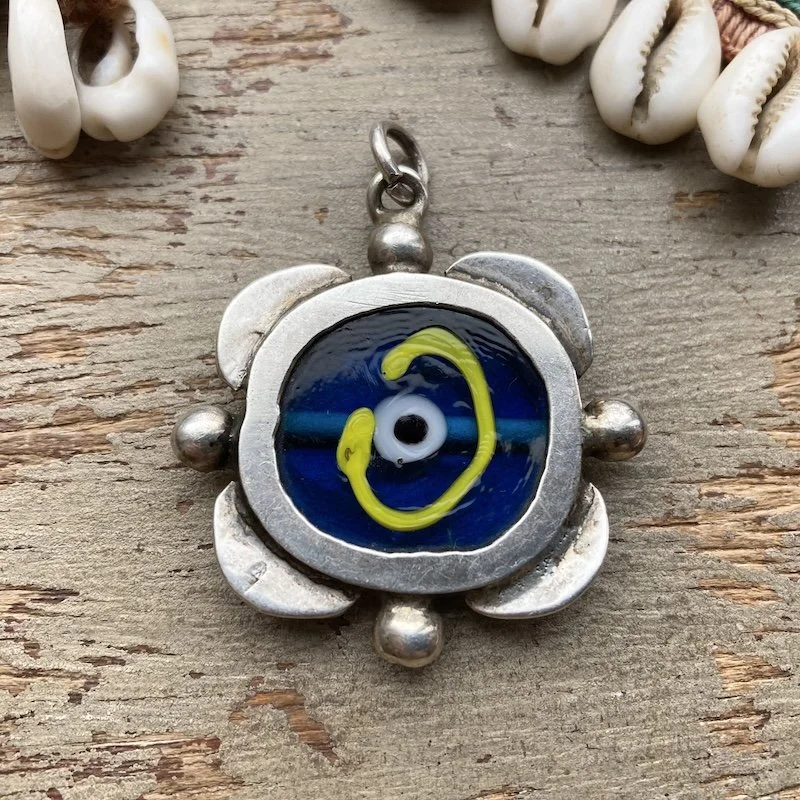 vintage sterling silver and glass evil eye pendant.jpeg