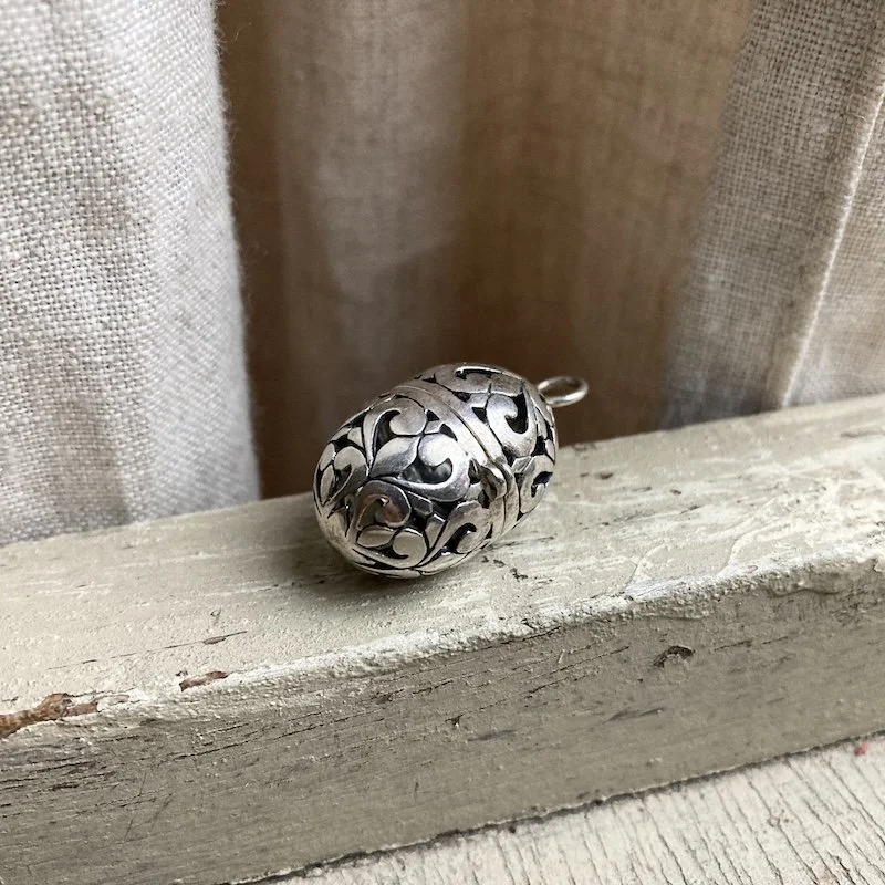 sterling silver ornate openwork locket.jpeg