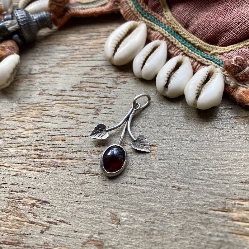 sterling silver garnet leaf pendant.jpeg