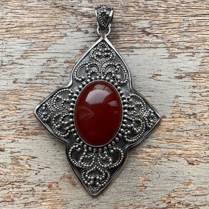 large Balinese ornate sterling silver and carnelian pendant 1.jpeg