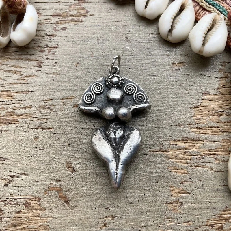 vintage solid silver goddess pendant.jpeg
