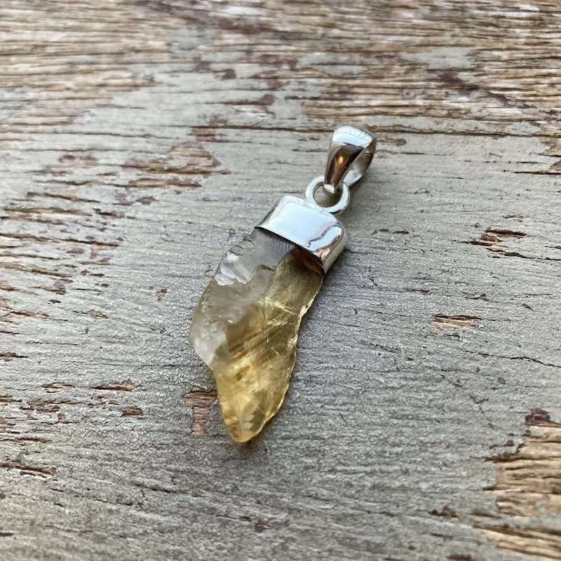 sterling silver and raw citrine pendant.jpeg