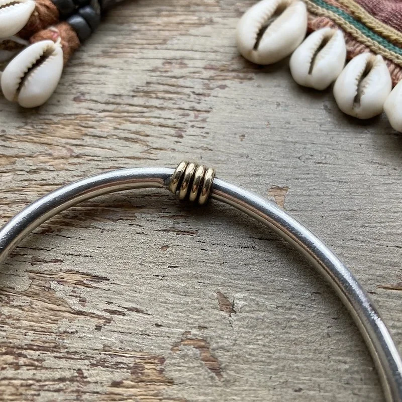 minimalist sterling silver bangle with gold-plated detail 3.jpeg