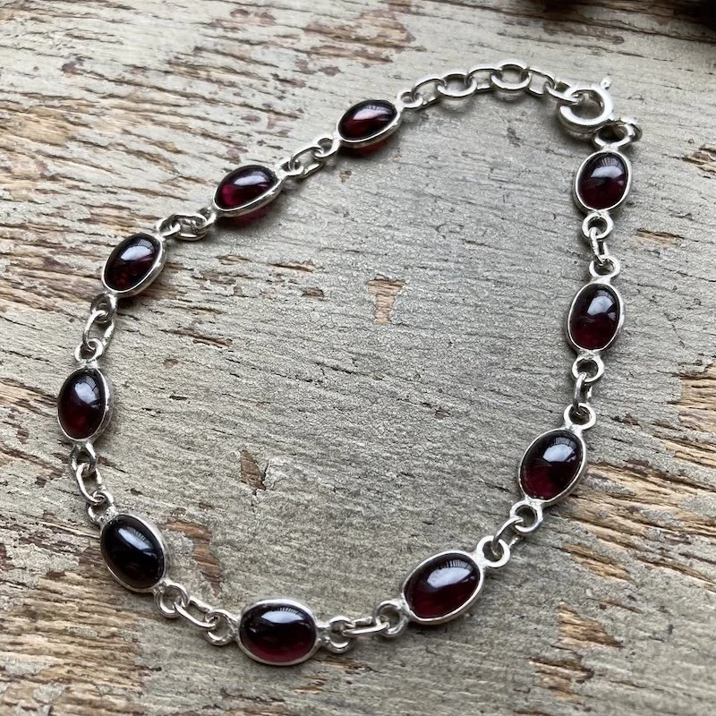 sterling silver garnet bracelet.jpeg