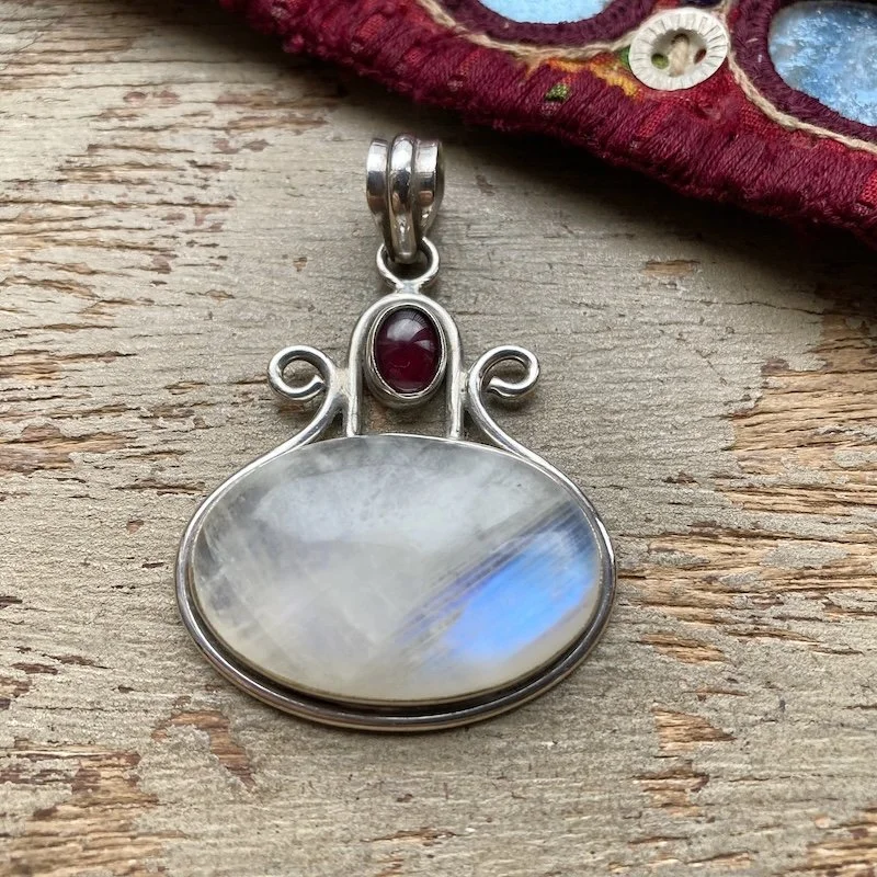 sterling silver rainbow moonstone and garnet pendant .jpeg