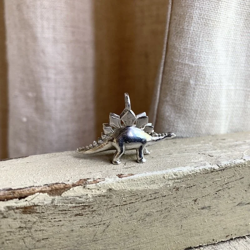 solid silver Stegosaurus pendant 2.jpeg