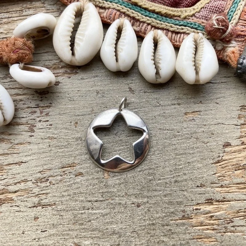 simple sterling silver star pendant.jpeg