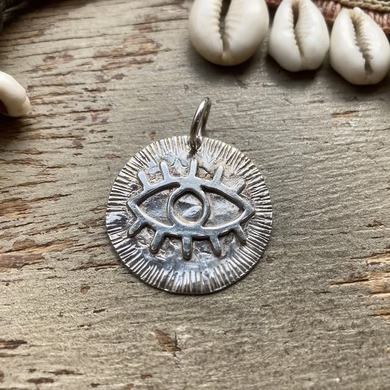 vintage sterling silver eye pendant.jpeg