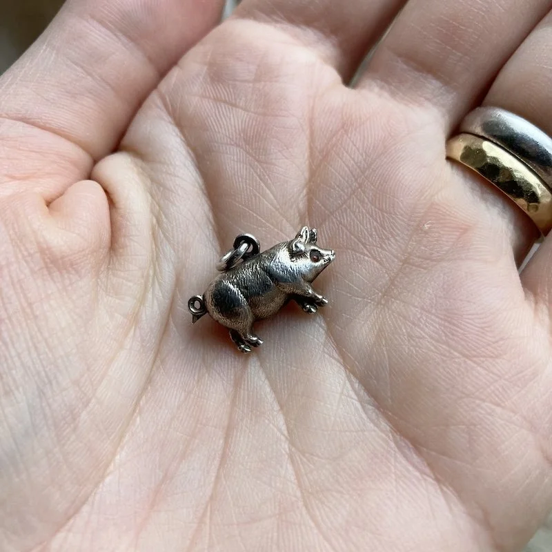 antique sterling silver pig pendant.jpeg