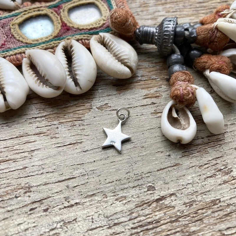 tiny little sterling silver star pendant 2.jpeg