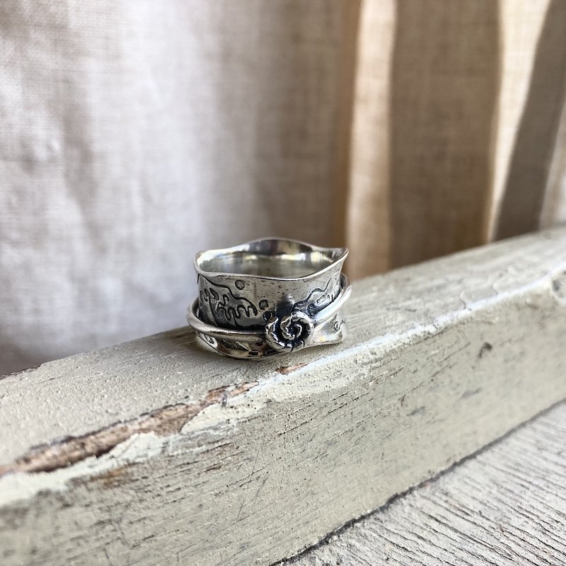 sterling silver earthy spinner ring 1.jpeg