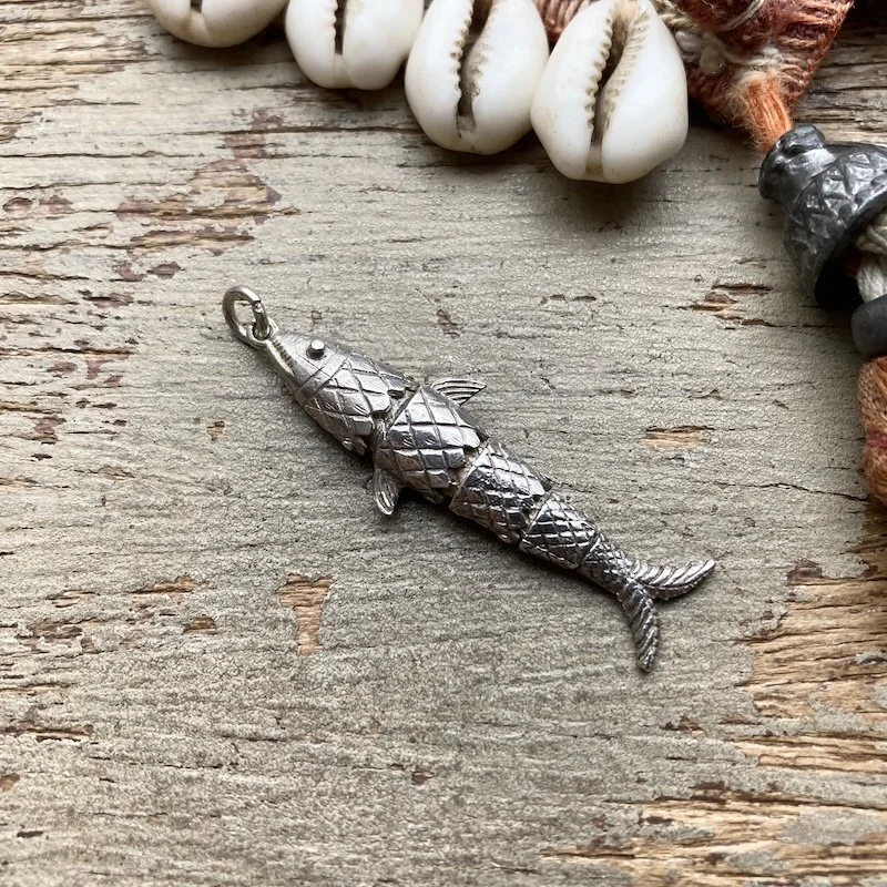 vintage sterling silver articulated fish pendant.jpeg