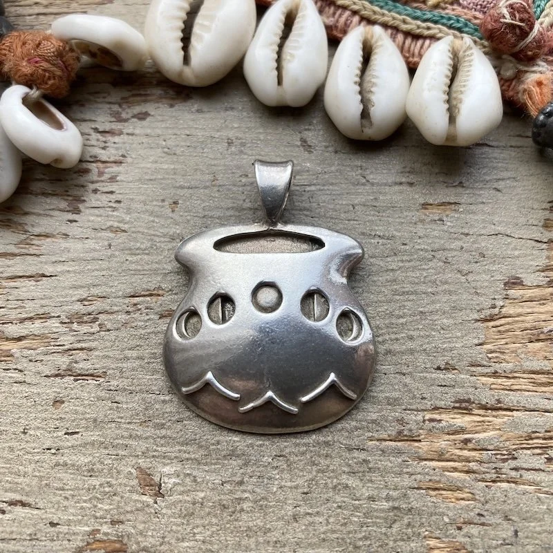 vintage sterling silver cauldron pendant.jpeg