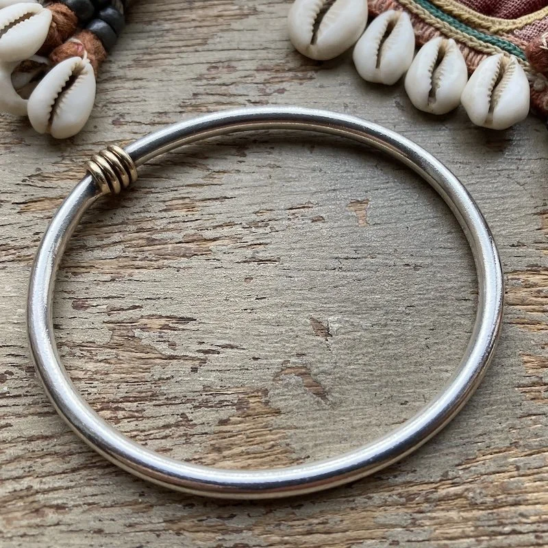 minimalist sterling silver bangle with gold-plated detail 2.jpeg