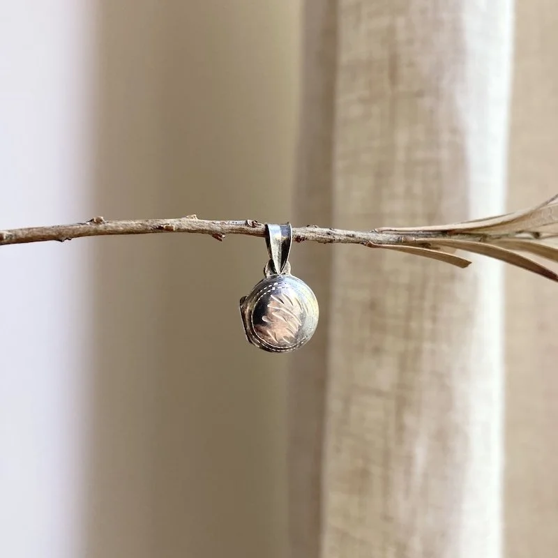 tiny round sterling silver locket 5.jpeg