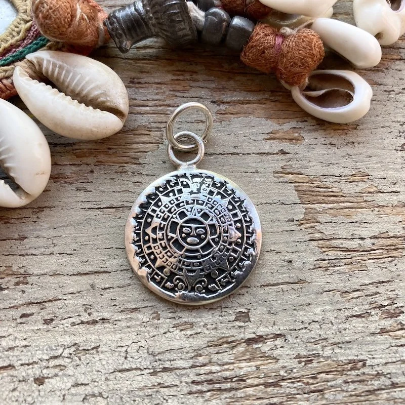 vintage sterling silver Mayan sun pendant 1.jpeg